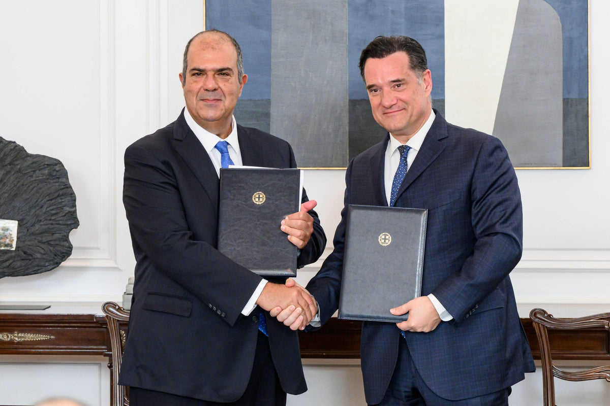 Sir Stelios Haji-Ioannou and Greece’s Minister of Health holding the signed healthcare donation agreement.