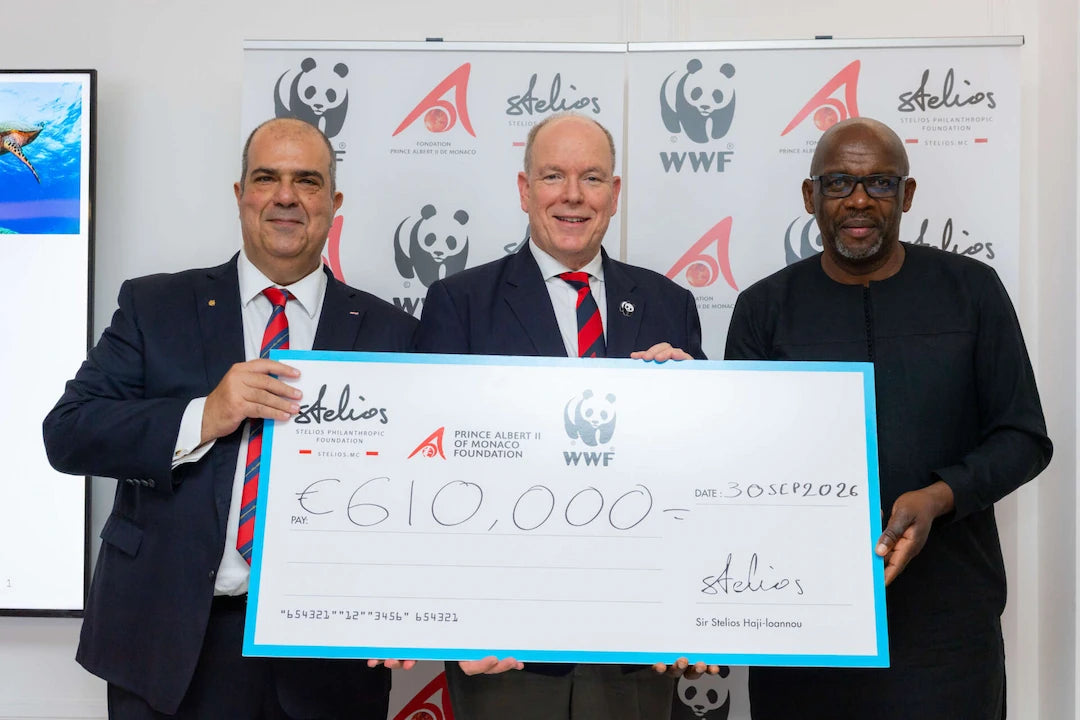 Sir Stelios and supporters holding a €610,000 cheque at the Monaco marine-conservation fundraiser.